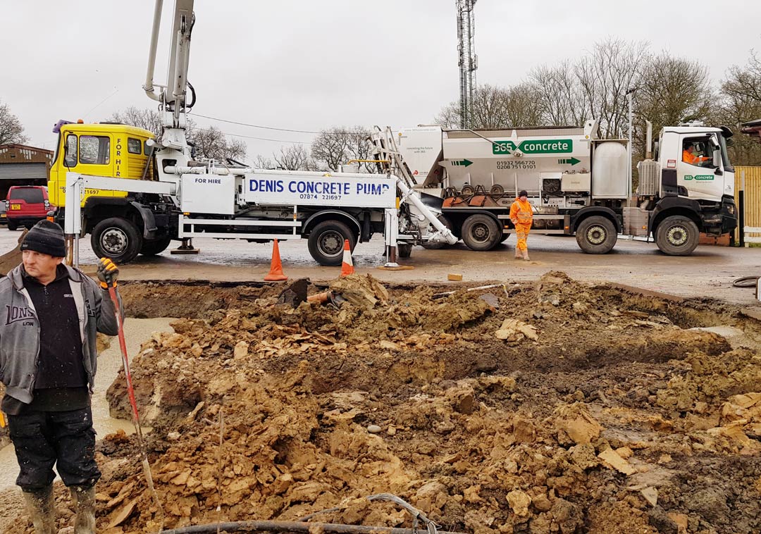 365 Concrete volumetric mixer at work with a concrete pump